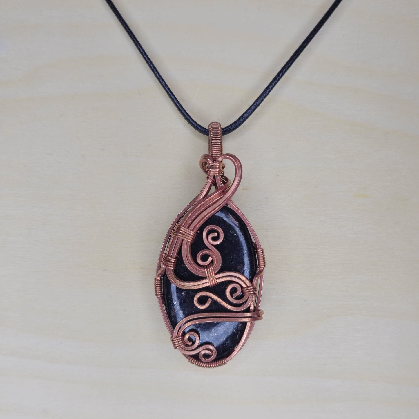 Nuumite Crystal Pendant - Wire Wrapped